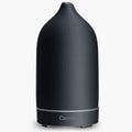 AAAAroma! Moderner Keramik Aroma Diffuser für ätherische Öle mit LED Licht 3-in-1: Ultraschall Diffusor, Luftbefeuchter und Nachtlicht - 100 ml Wassertank (Schwarz)